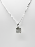 Hammered blobby pendant by Rebecca Oldfield