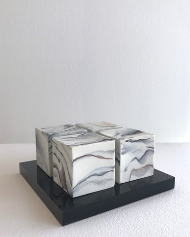 4 cubes on plinth by Kim Colebrook