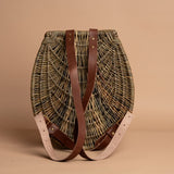 Shaped backpack with leather strap by Alisha Davidson