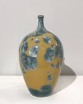 Crystaline bottle form in gold & blue by Simon Rich