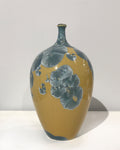 Crystaline bottle form in gold & blue by Simon Rich