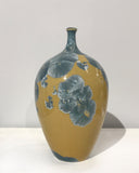 Crystaline bottle form in gold & blue by Simon Rich
