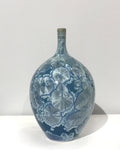 Crystaline bottle form in teal by Simon Rich