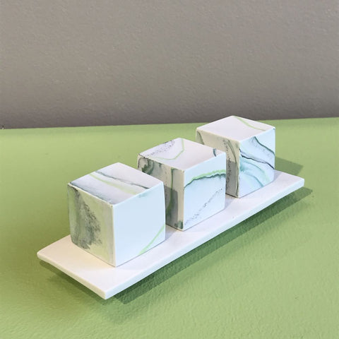3 small cubes on plinth by Kim Colebrook