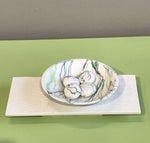 Wide bowl and pebbles on plinth by Kim Colebrook