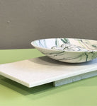 Wide bowl and pebbles on plinth by Kim Colebrook