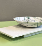 Wide bowl and pebbles on plinth by Kim Colebrook