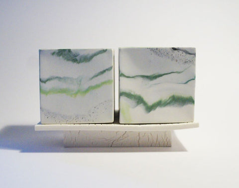 2 medium cubes on burnt porcelain plinth by Kim Colebrook