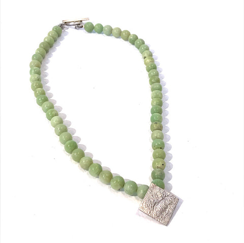 Green jade necklace with moonscape pendant by Anne Morgan