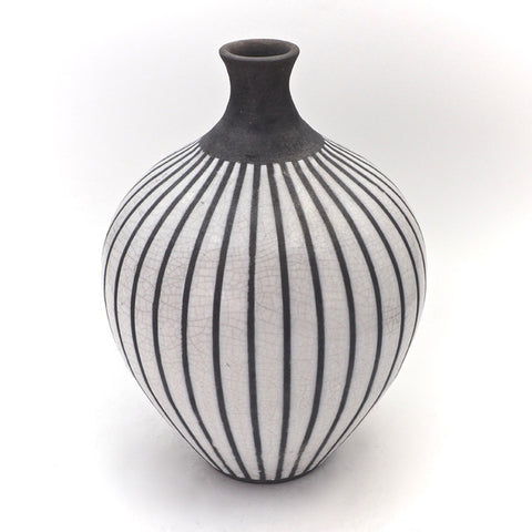 Black and white pot with vertical line pattern and crackle glaze by Jodie Neale