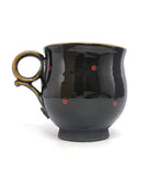 Round mug with red dots by Mick Morgan