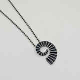 Maxi dark ammonite pendant by Suzie Horan