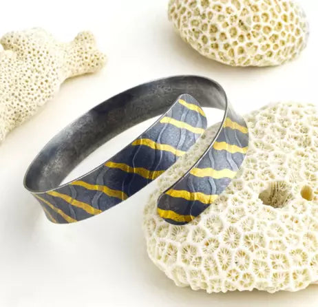 Oxidised silver ripple cuff with gold waves by Sandra Elizabeth