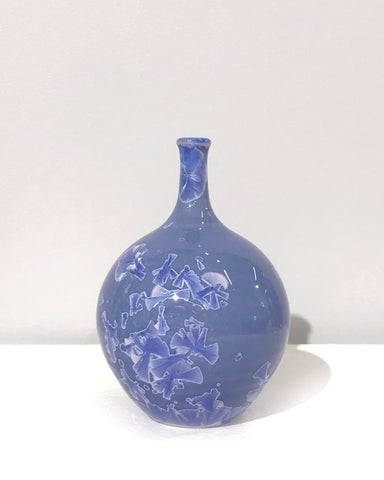 Small crystaline bottle form in mid blue by Simon Rich