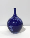Small crystaline bottle form in dark blue by Simon Rich