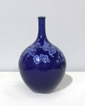 Small crystaline bottle form in dark blue by Simon Rich