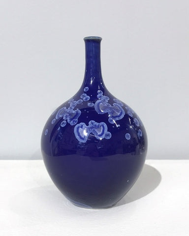 Small crystaline bottle form in dark blue by Simon Rich