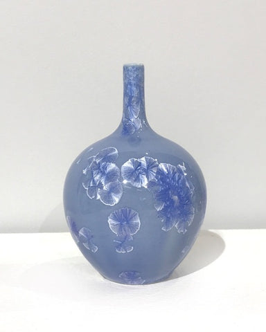 Small crystaline bottle form in mid blue by Simon Rich