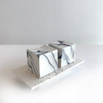 2 cubes on porcelain plinth by Kim Colebrook
